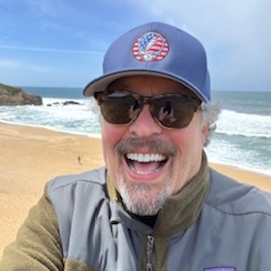 Augie West smiling at the beach